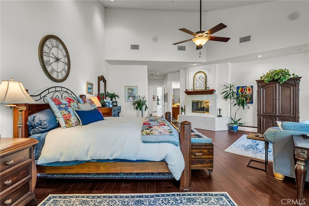 6872 Chartwell Drive Riverside, CA 92506 - Photo 24 of 51 a living room with furniture a clock and a clock