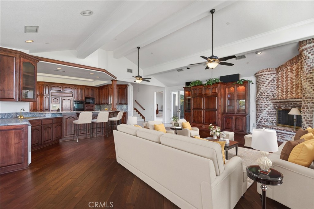 6872 Chartwell Drive Riverside, CA 92506 - Photo 25 of 75 a living room with furniture and a chandelier