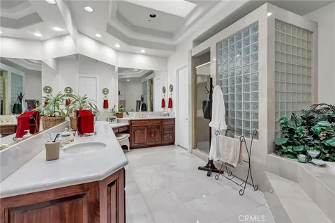 a living room with furniture and flowers