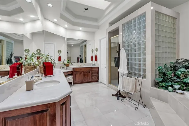 a living room with furniture and flowers