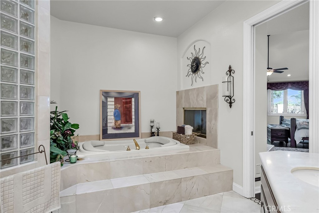 6872 Chartwell Drive Riverside, CA 92506 - Photo 27 of 51 a living room with furniture and a fireplace