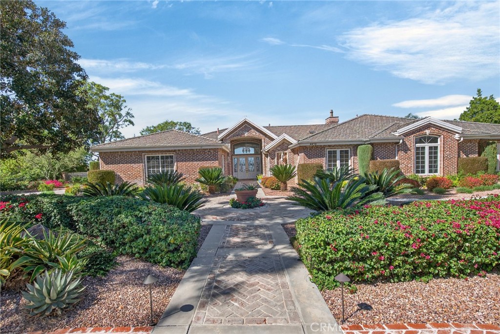 6872 Chartwell Drive Riverside, CA 92506 - Photo 3 of 75 a view of a house with a garden and pathway