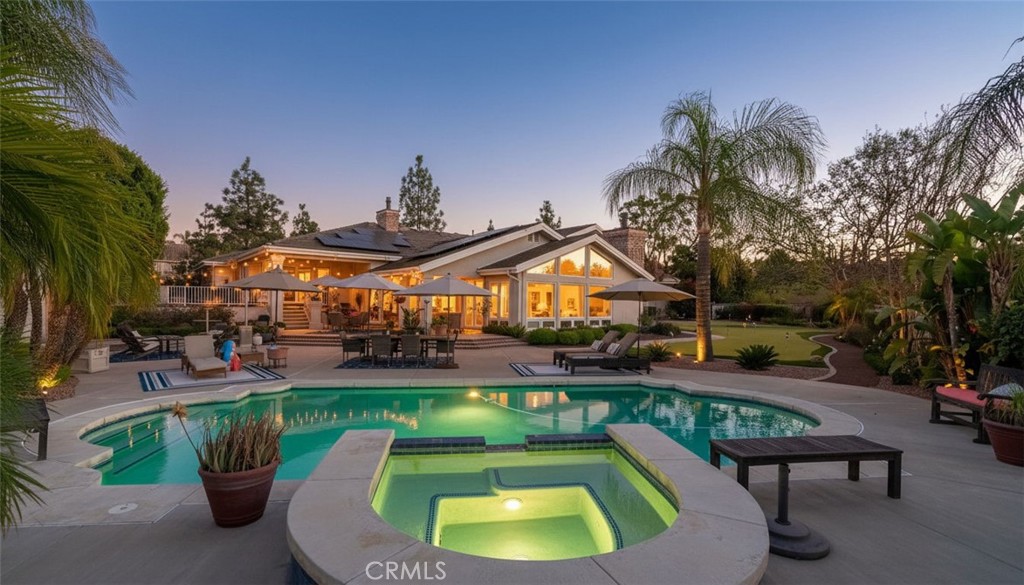 6872 Chartwell Drive Riverside, CA 92506 - Photo 32 of 51 a view of a swimming pool with a patio and a yard