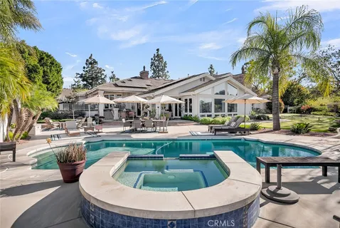 a view of a swimming pool with lounge chair