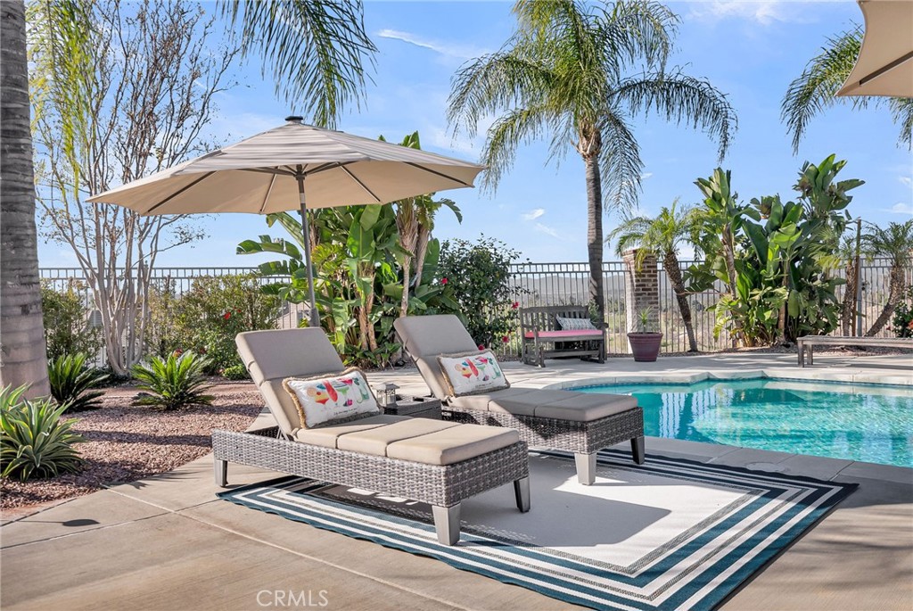 6872 Chartwell Drive Riverside, CA 92506 - Photo 36 of 51 a view of backyard with outdoor seating and trees
