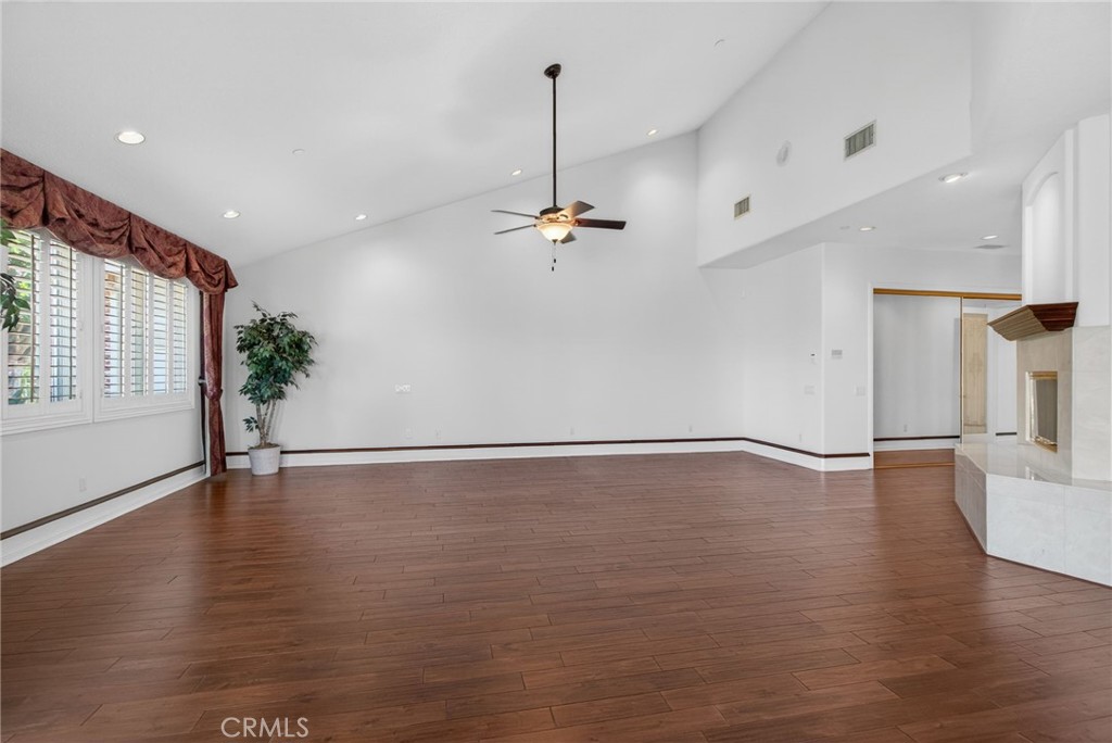 6872 Chartwell Drive Riverside, CA 92506 - Photo 38 of 75 a view of an empty room with wooden floor and a window