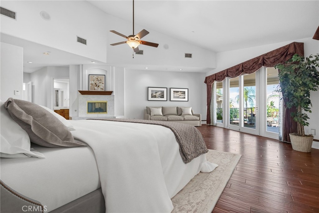 6872 Chartwell Drive Riverside, CA 92506 - Photo 41 of 75 a spacious bedroom with a large bed and a large window
