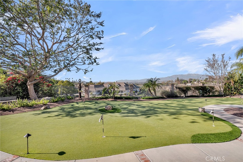 6872 Chartwell Drive Riverside, CA 92506 - Photo 44 of 51 a view of a swimming pool with an ocean view