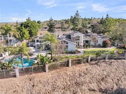 an aerial view of a house with a lot of flower plants