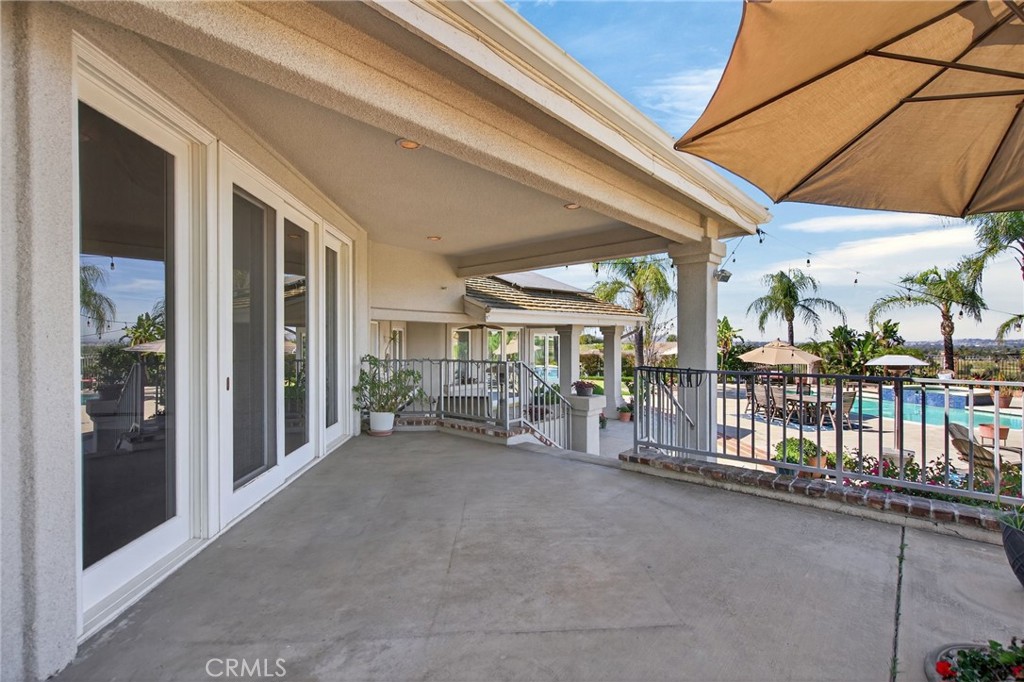 6872 Chartwell Drive Riverside, CA 92506 - Photo 63 of 75 a view of a patio with table and chairs