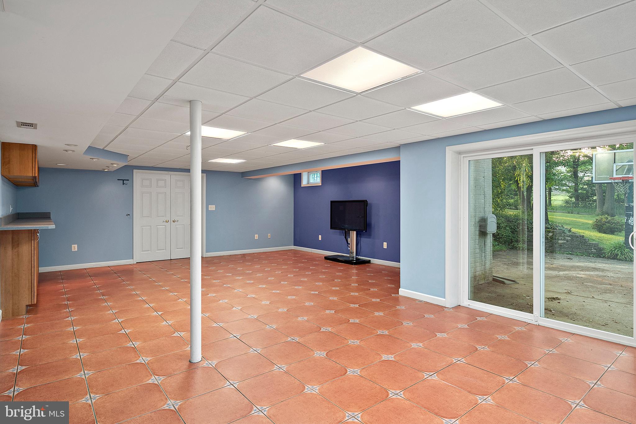 5872 Montgomery Road Elkridge, MD 21075 - Photo 42 of 81 Lower lever rec room with Sliders to lower patio
