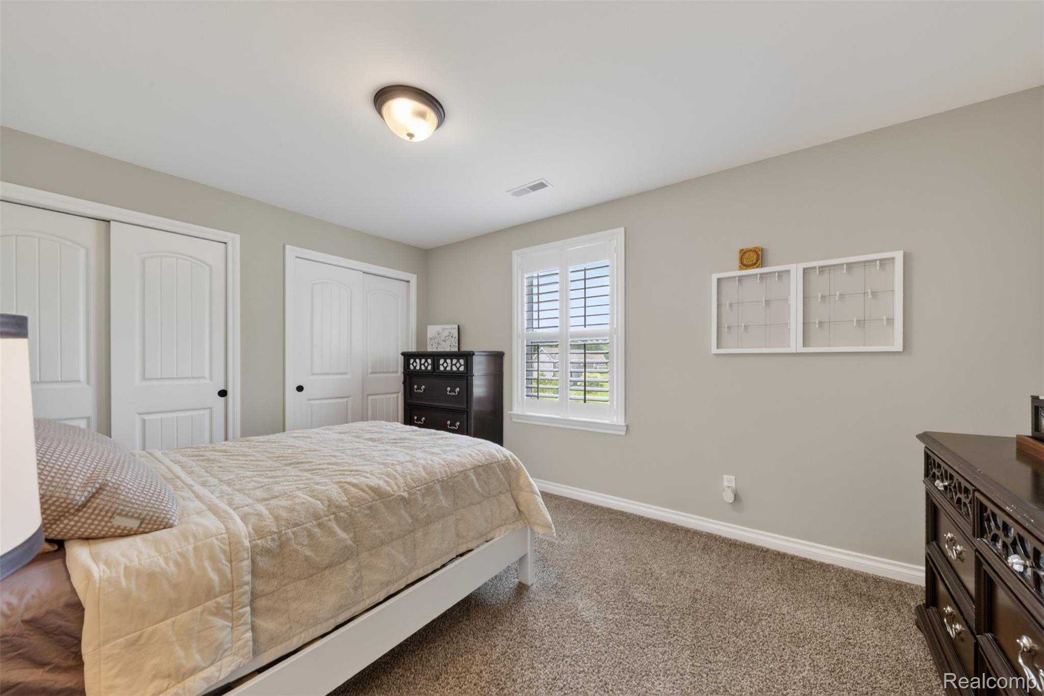 2531 Walnut View Drive Howell, MI 48855 - Photo 21 of 34 Neutral wall colors and carpeted flooring