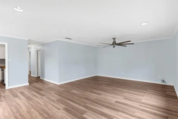 wooden floor in a empty room with a window