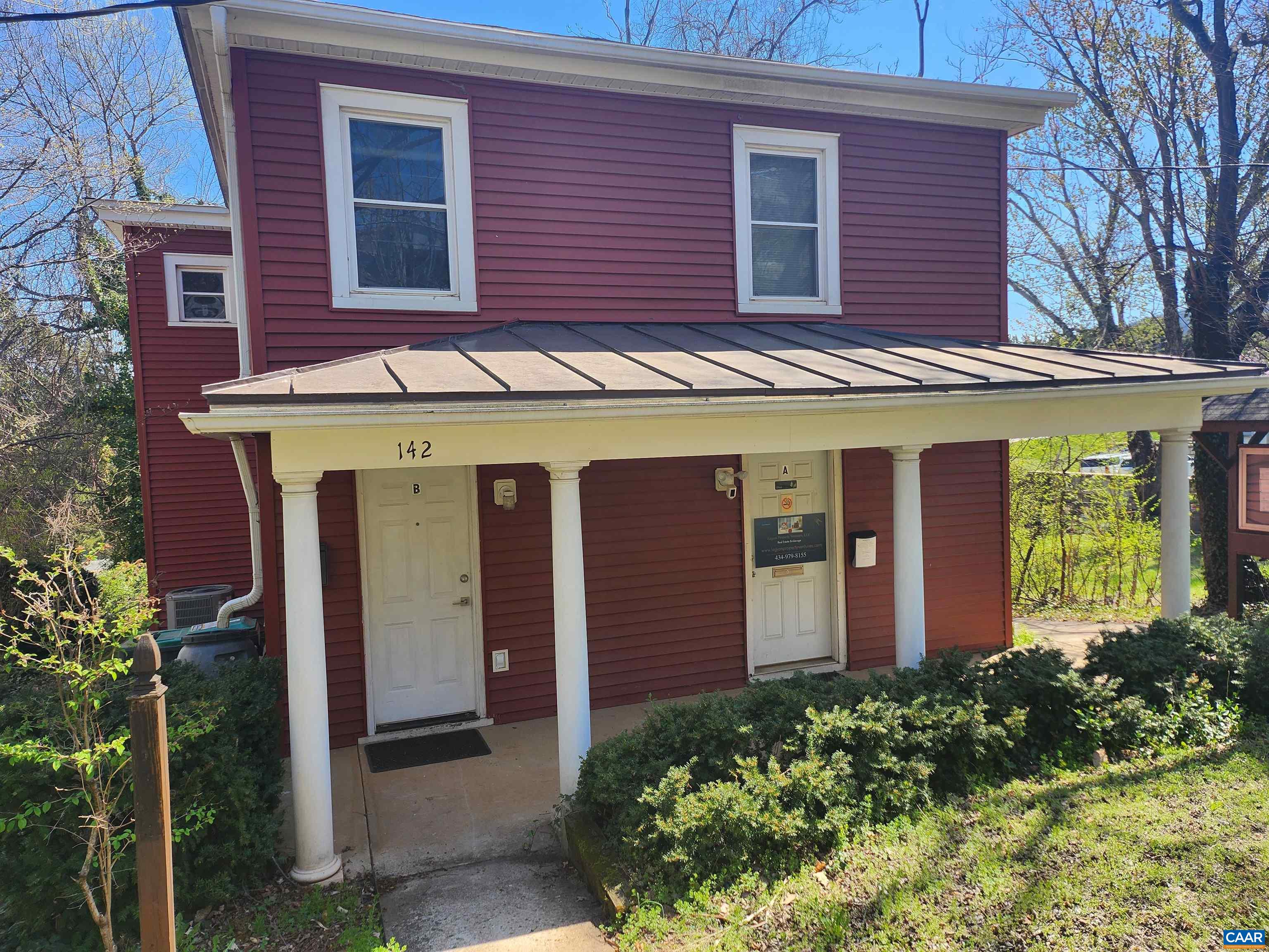 142 Carlton Road, Unit B Charlottesville, VA 22902 - Photo 1 of 13 a front view of a house with plants