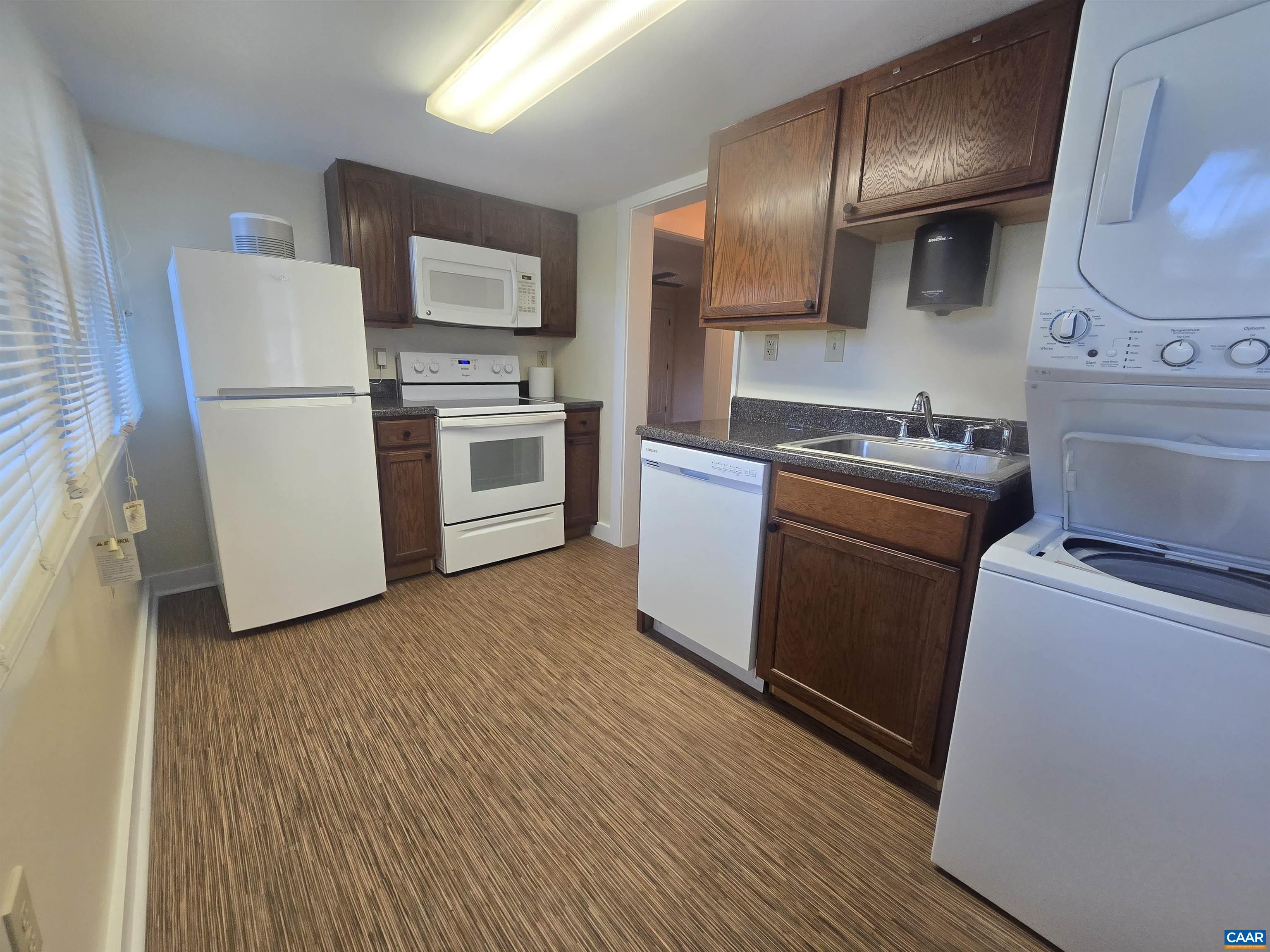 142 Carlton Road, Unit B Charlottesville, VA 22902 - Photo 5 of 13 a kitchen with a sink a stove and refrigerator
