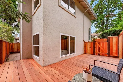 a backyard of a house with wooden floor
