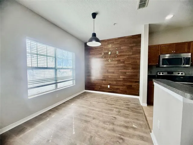 a view of livingroom with kitchen and window