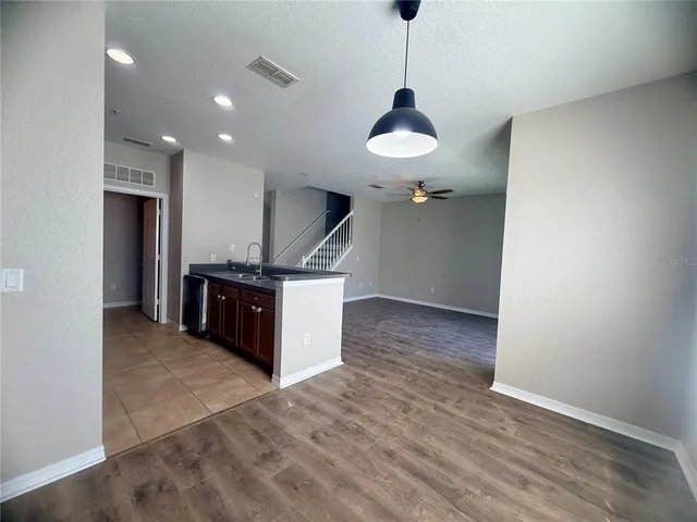 a kitchen with stainless steel appliances a sink and a refrigerator
