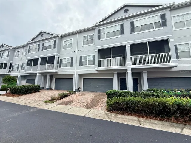 a front view of a building with garden