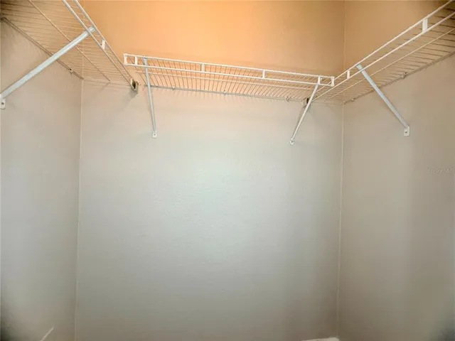 a view of a room with racks on the wall