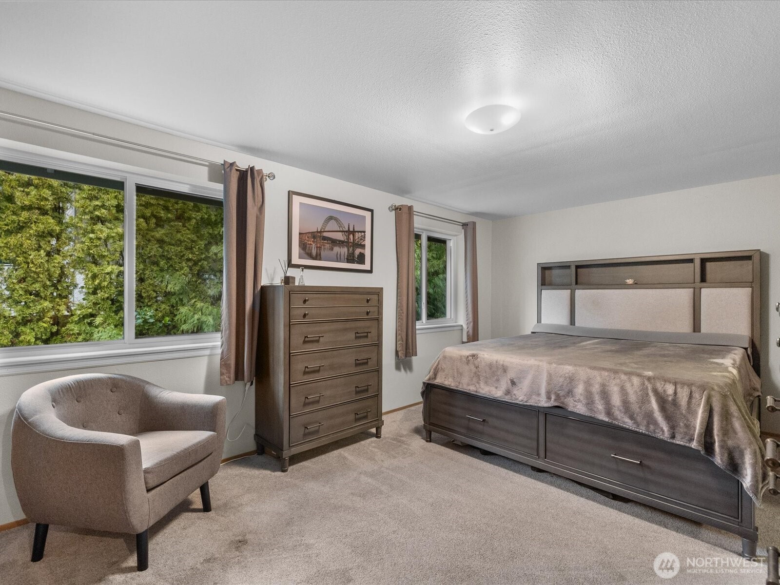21227 76th Avenue West, Unit B8 Edmonds, WA 98026 - Photo 16 of 29 a bedroom with a bed and a couch