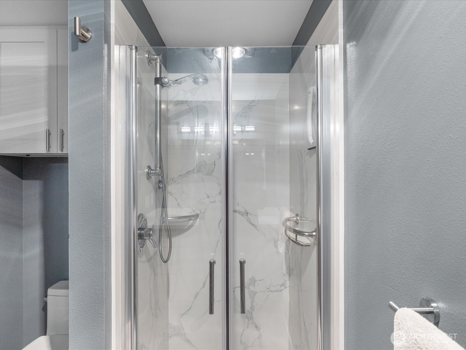 21227 76th Avenue West, Unit B8 Edmonds, WA 98026 - Photo 19 of 29 a bathroom with a glass shower door