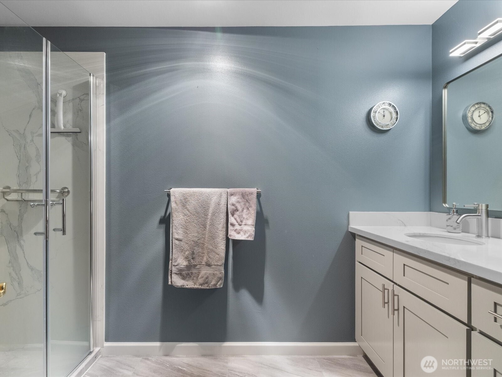 21227 76th Avenue West, Unit B8 Edmonds, WA 98026 - Photo 20 of 29 a bathroom with a sink and mirror