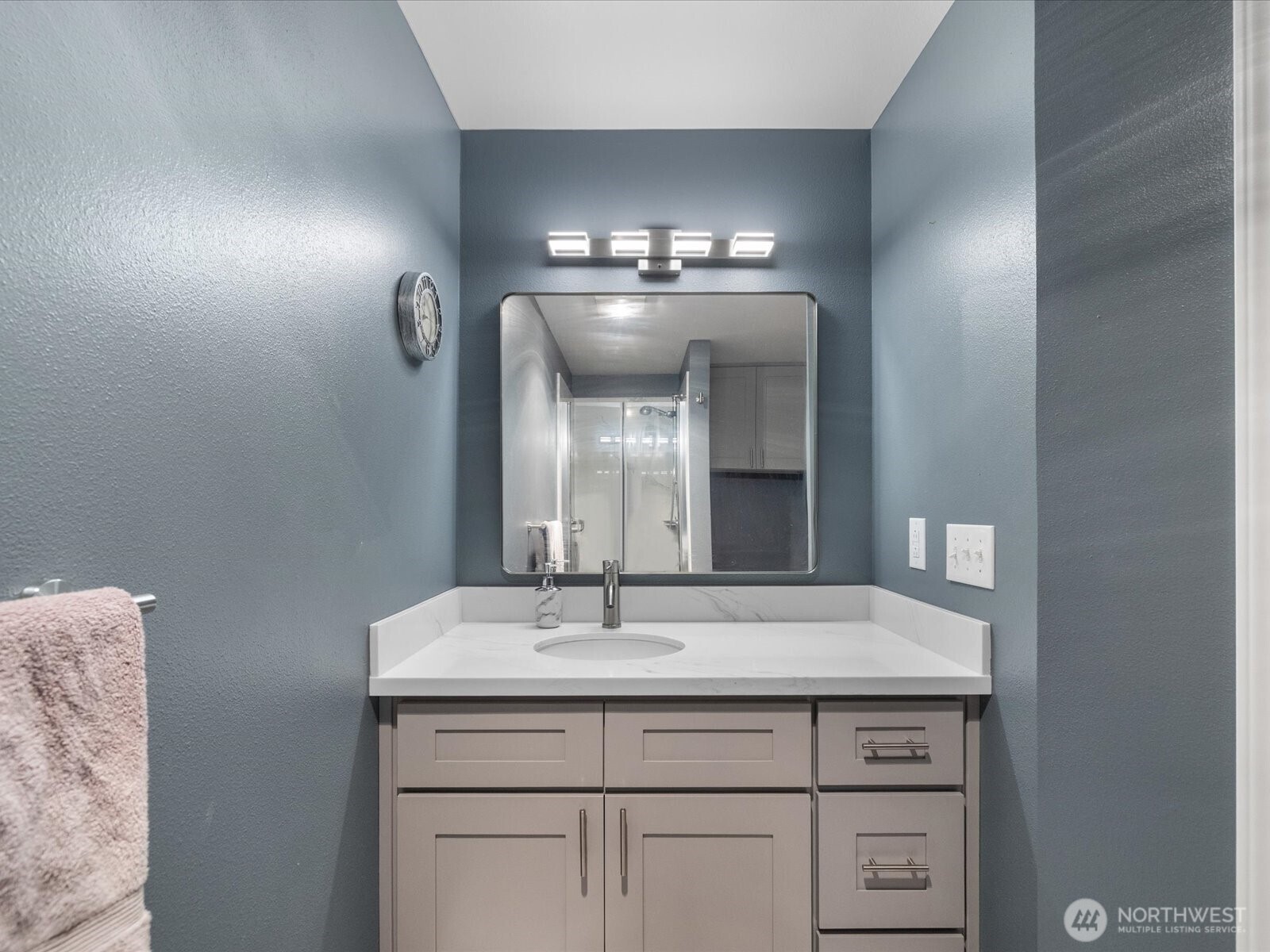 21227 76th Avenue West, Unit B8 Edmonds, WA 98026 - Photo 21 of 29 a bathroom with a sink and a mirror