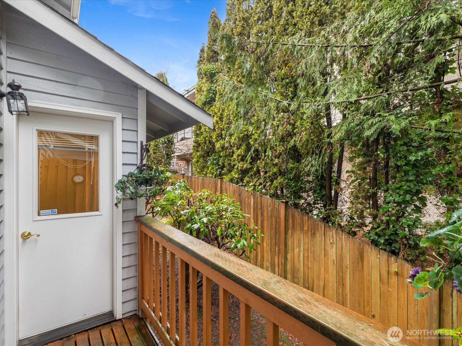 21227 76th Avenue West, Unit B8 Edmonds, WA 98026 - Photo 27 of 29 a balcony with trees in front of it