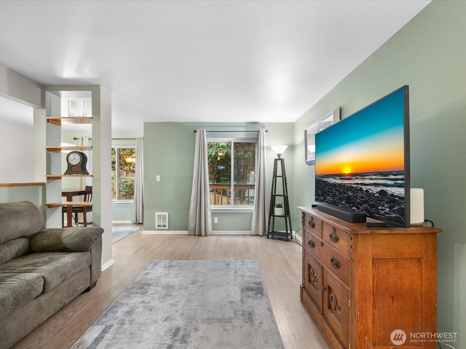 21227 76th Avenue West, Unit B8 Edmonds, WA 98026 - Photo 7 of 29 a living room with furniture flat screen tv and a fireplace
