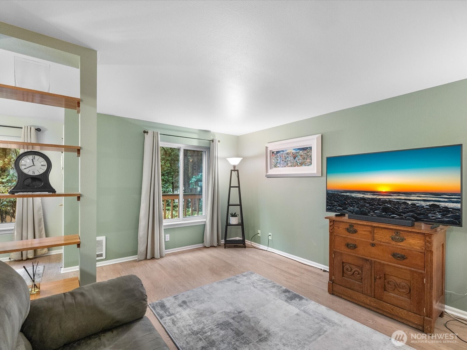 21227 76th Avenue West, Unit B8 Edmonds, WA 98026 - Photo 8 of 29 a living room with furniture and a flat screen tv