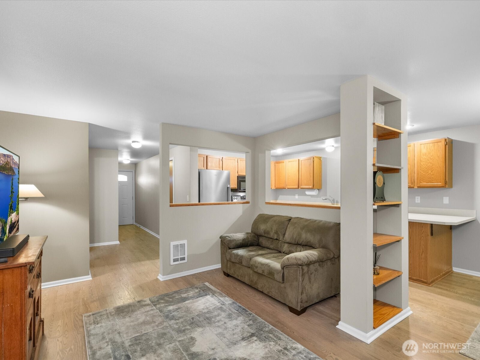 21227 76th Avenue West, Unit B8 Edmonds, WA 98026 - Photo 9 of 29 a living room with furniture and view of kitchen