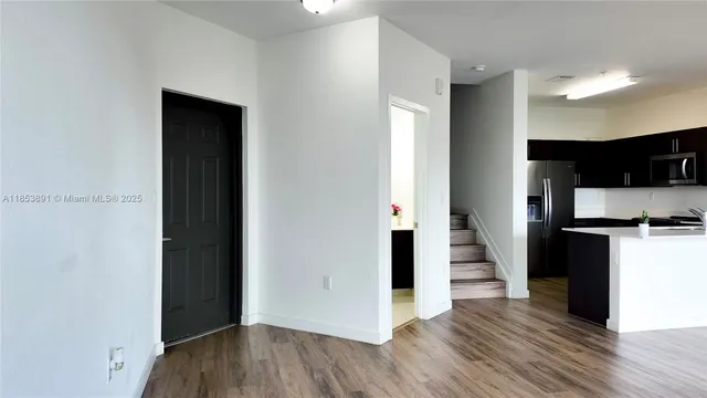 a view of a kitchen from the hallway
