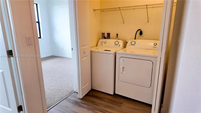 a utility room with dryer and washer