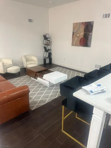 a view of a livingroom with furniture and window