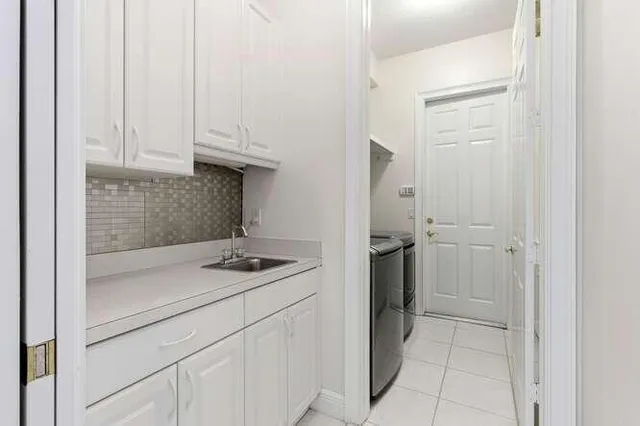 a kitchen with a sink and cabinets
