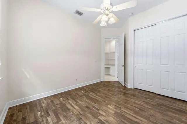 a view of an entryway with wooden floor