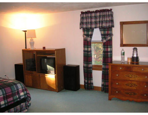 118 Kettle Hole Road Bolton, MA 01740 - Photo 8 of 14 a bedroom with a bed and a dresser