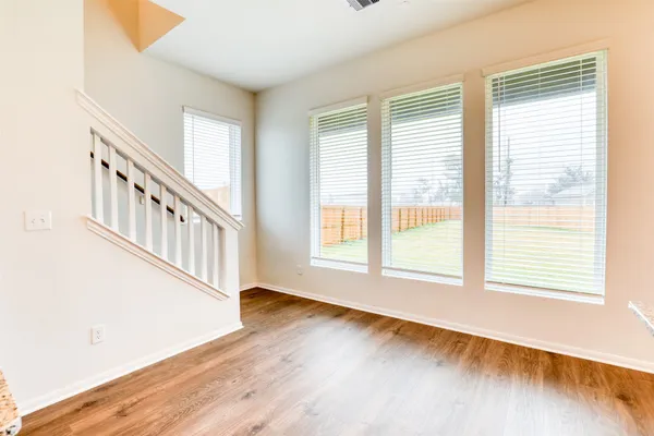 a view of an entryway with wooden floor