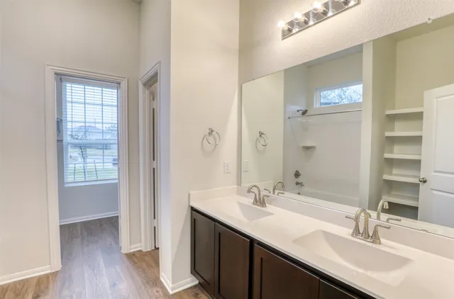 a view of a room with rack on the wall and a window