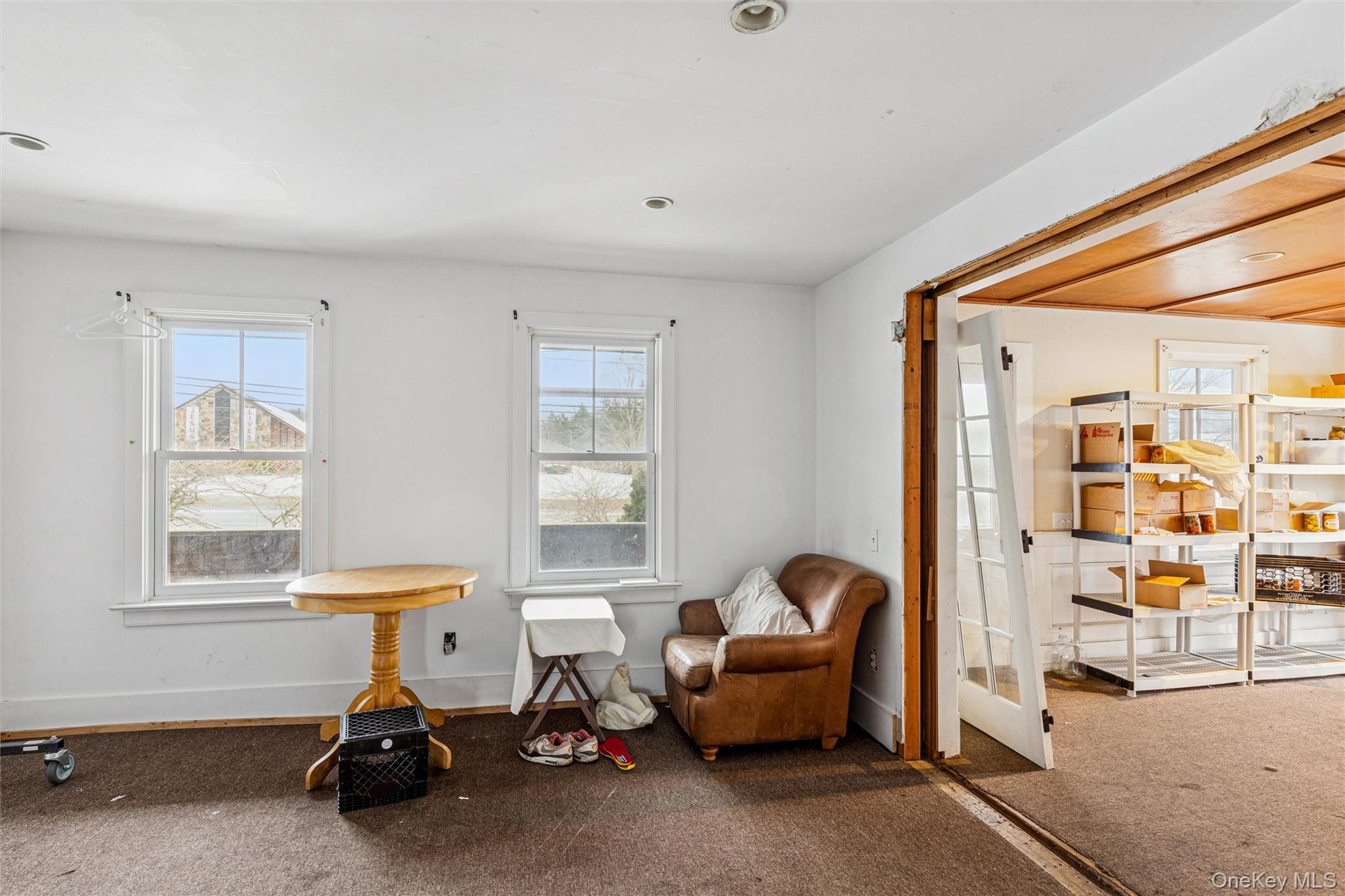 250 Main Road Riverhead, NY 11901 - Photo 18 of 31 a view of livingroom with furniture and windows