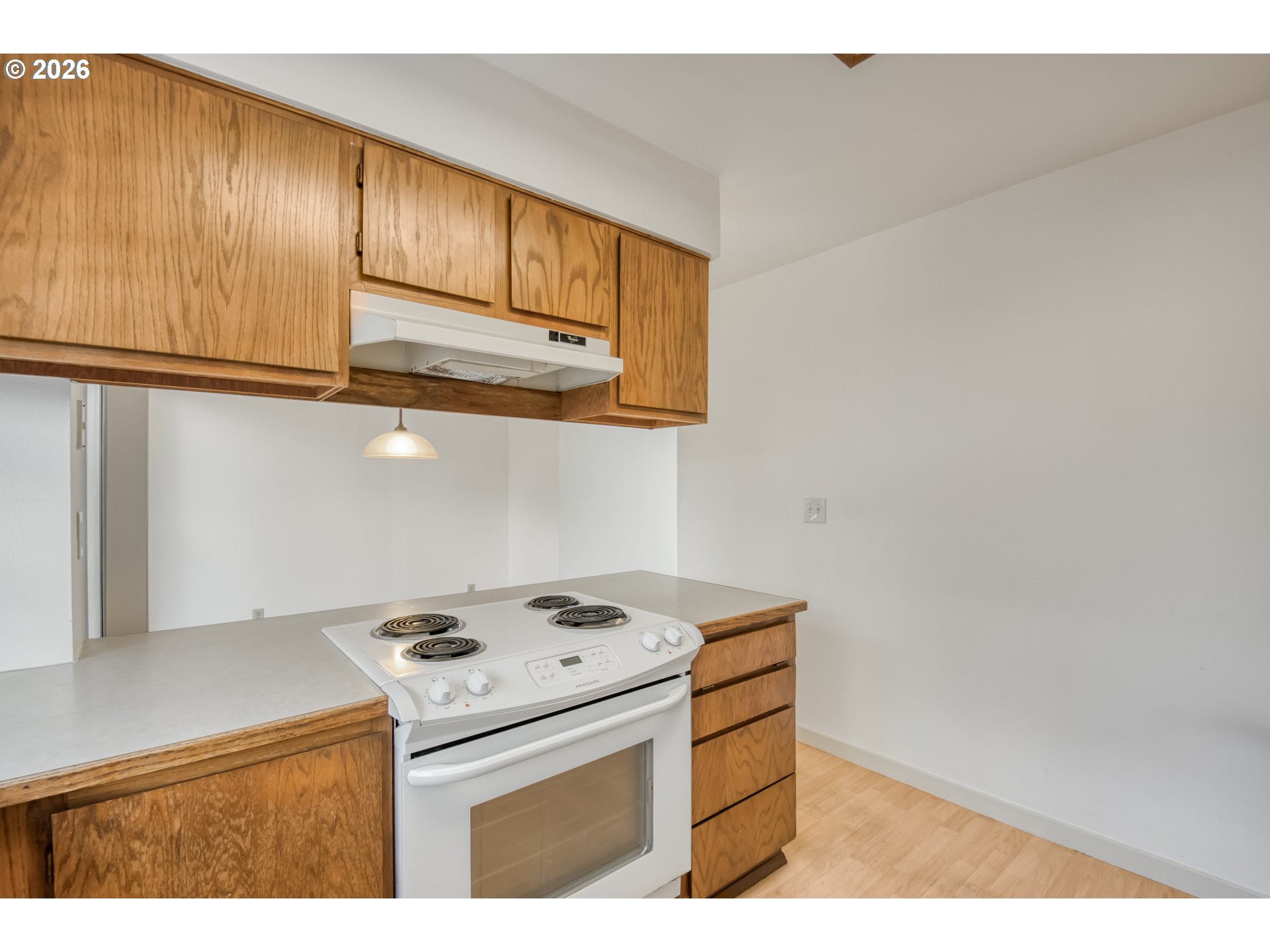 9731 Southwest London Court Portland, OR 97223 - Photo 12 of 27 a kitchen with cabinets and appliances