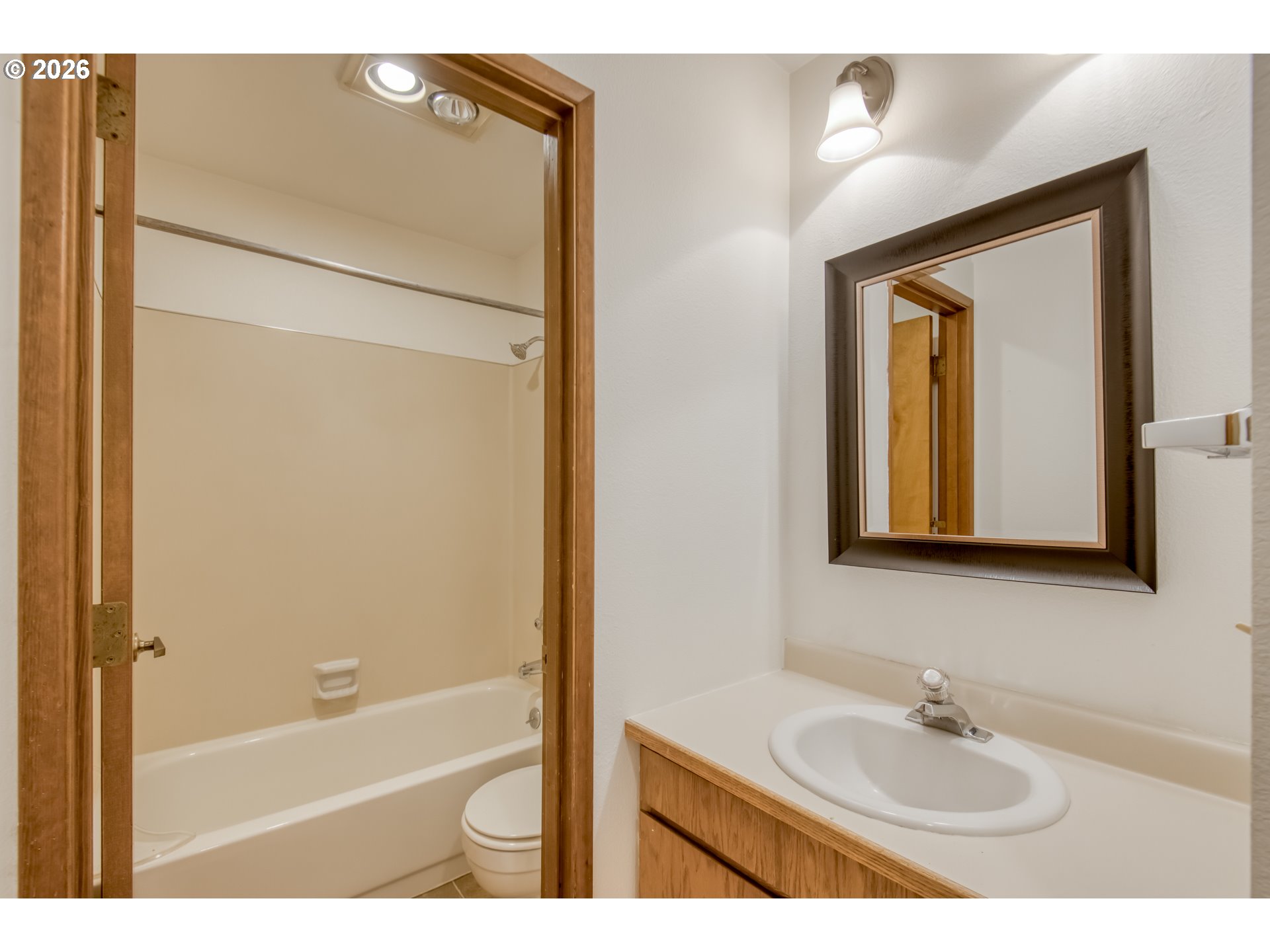 9731 Southwest London Court Portland, OR 97223 - Photo 14 of 27 a bathroom with a sink and a mirror