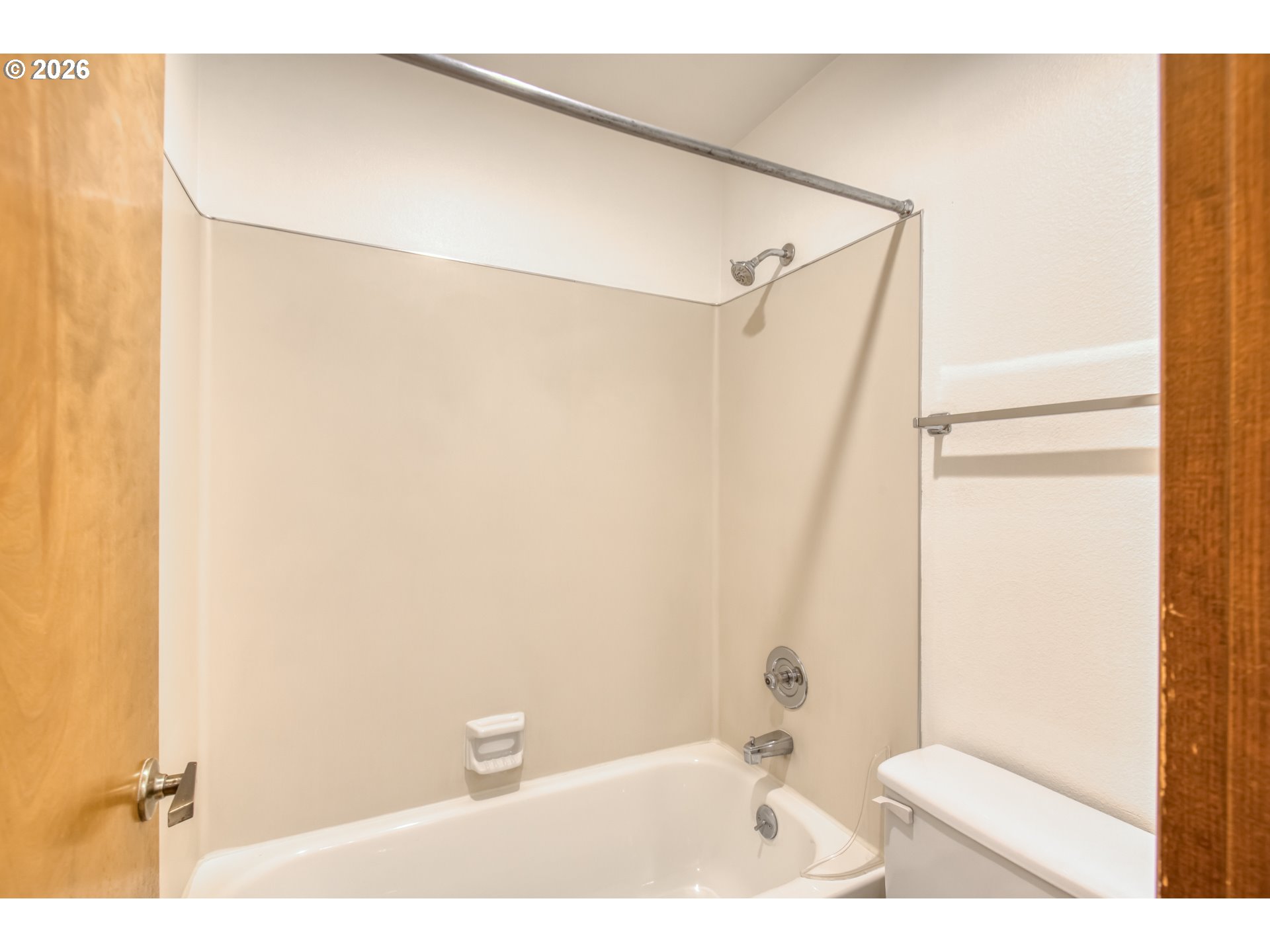 9731 Southwest London Court Portland, OR 97223 - Photo 15 of 27 a bathroom with a bathtub and a shower