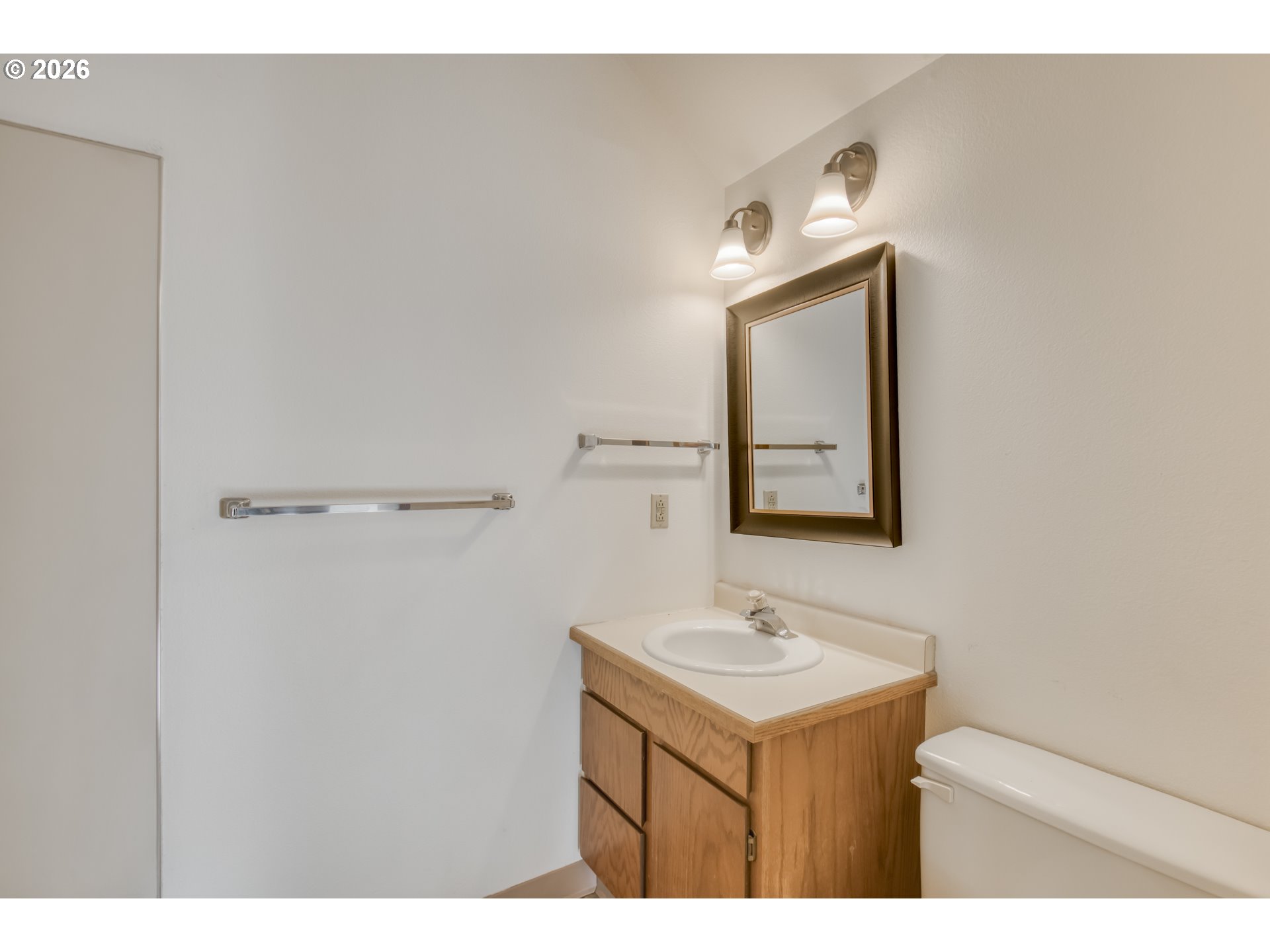 9731 Southwest London Court Portland, OR 97223 - Photo 22 of 27 a bathroom with a sink vanity and a mirror