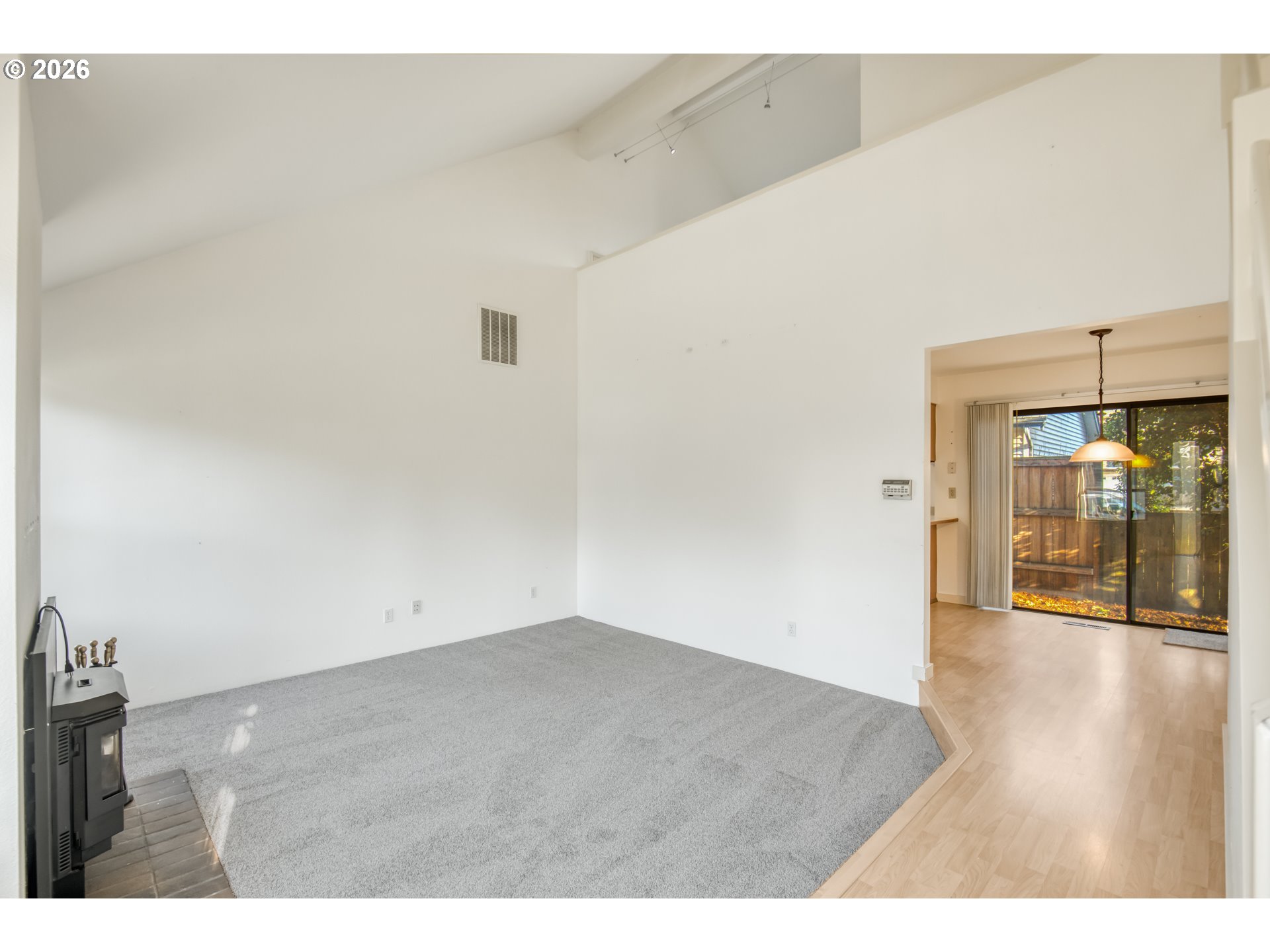 9731 Southwest London Court Portland, OR 97223 - Photo 4 of 27 a view of an empty room with wooden floor