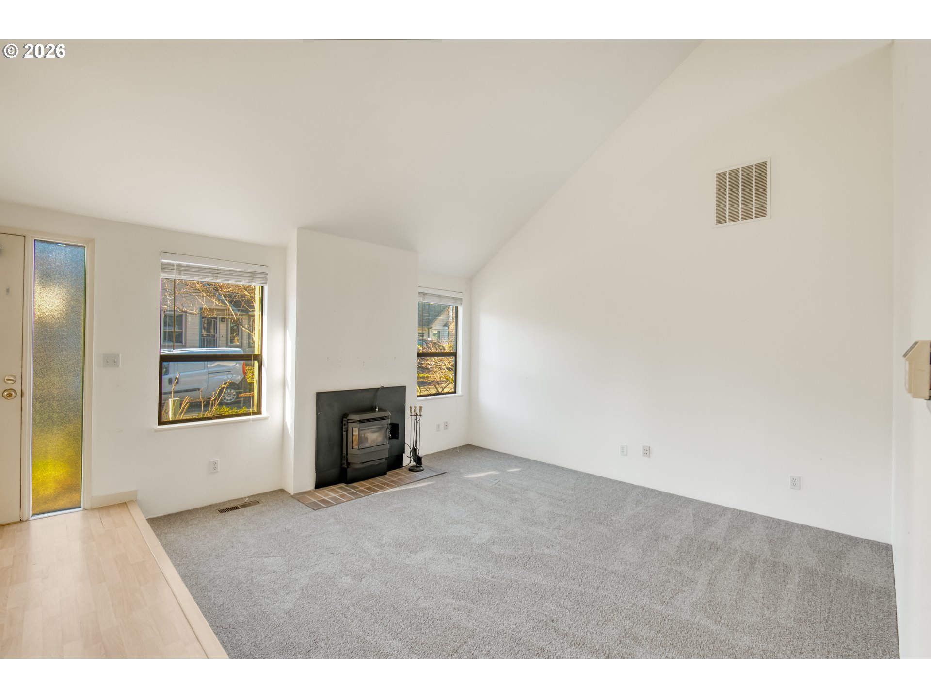 9731 Southwest London Court Portland, OR 97223 - Photo 5 of 27 a view of an empty room with a window