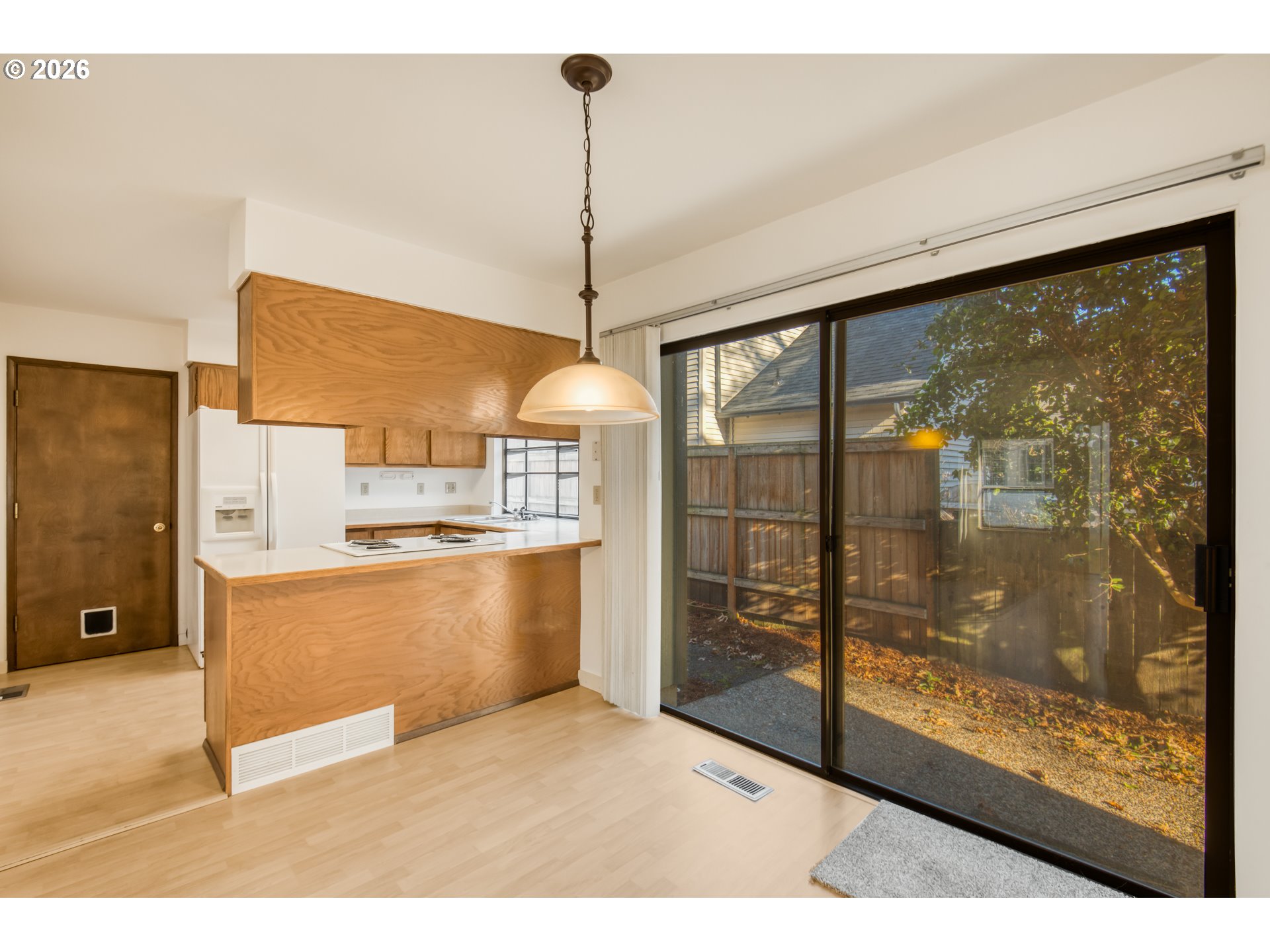 9731 Southwest London Court Portland, OR 97223 - Photo 8 of 27 a open kitchen with a wooden floor