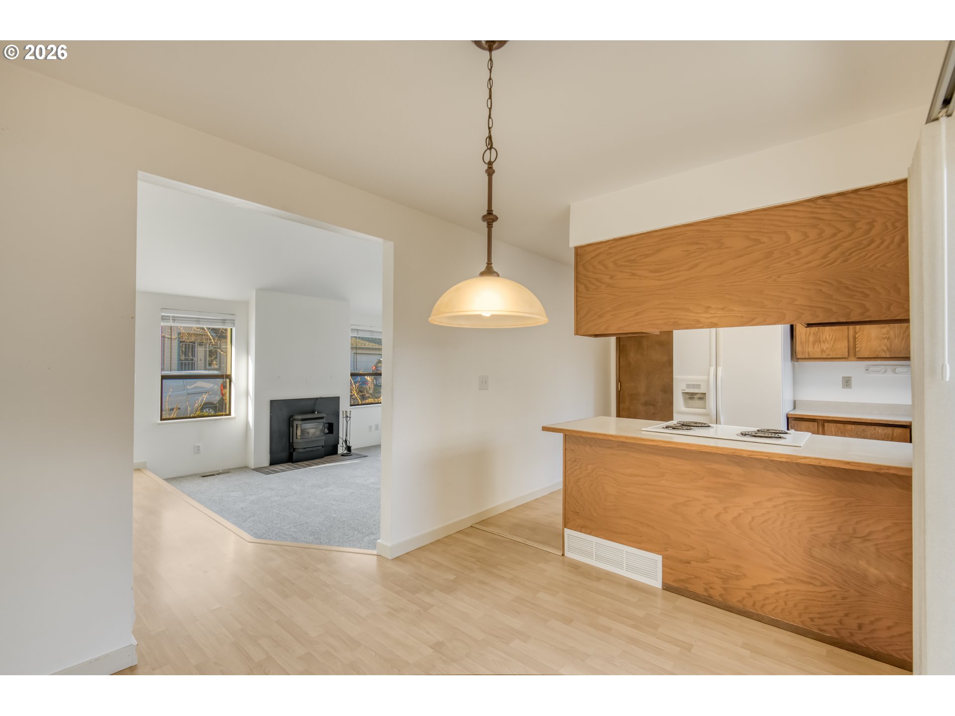 9731 Southwest London Court Portland, OR 97223 - Photo 9 of 27 a kitchen with stainless steel appliances granite countertop a sink a stove and a refrigerator