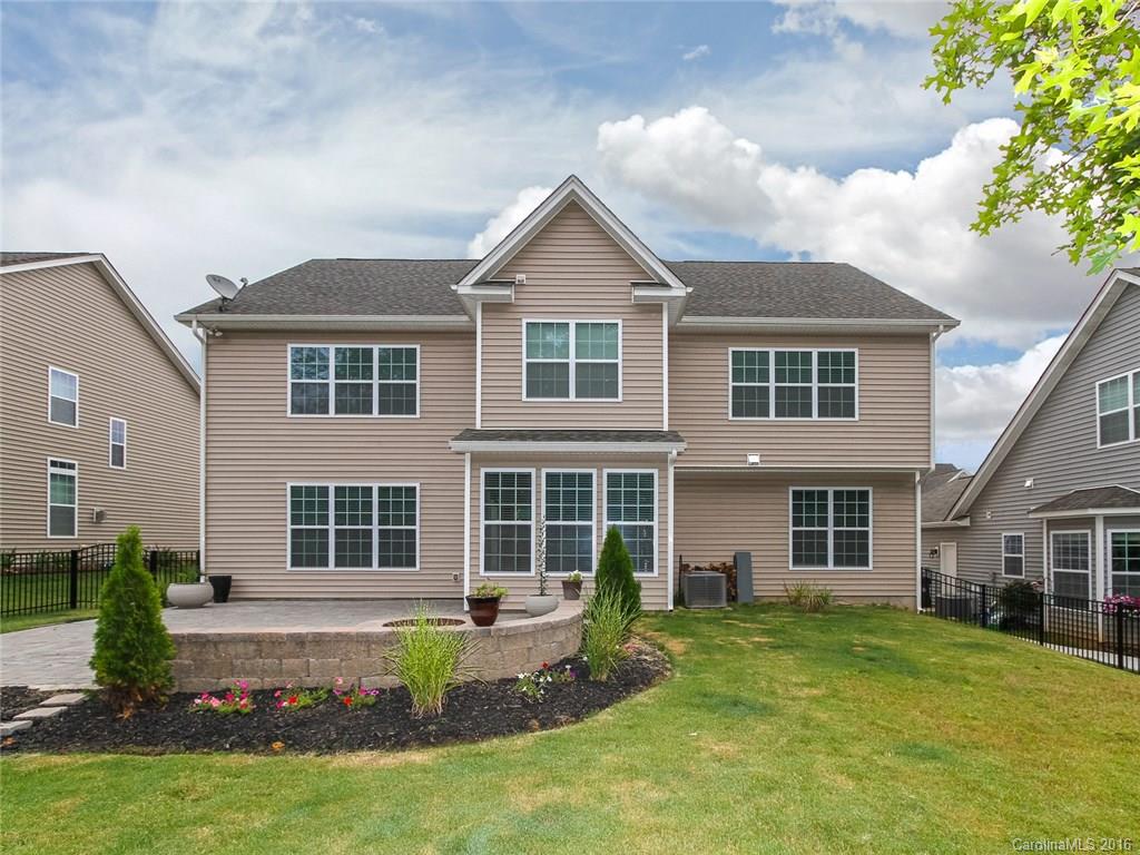 233 Annatto Way, Unit 553 Tega Cay, SC 29708 - Photo 17 of 22 a front view of a house with a yard